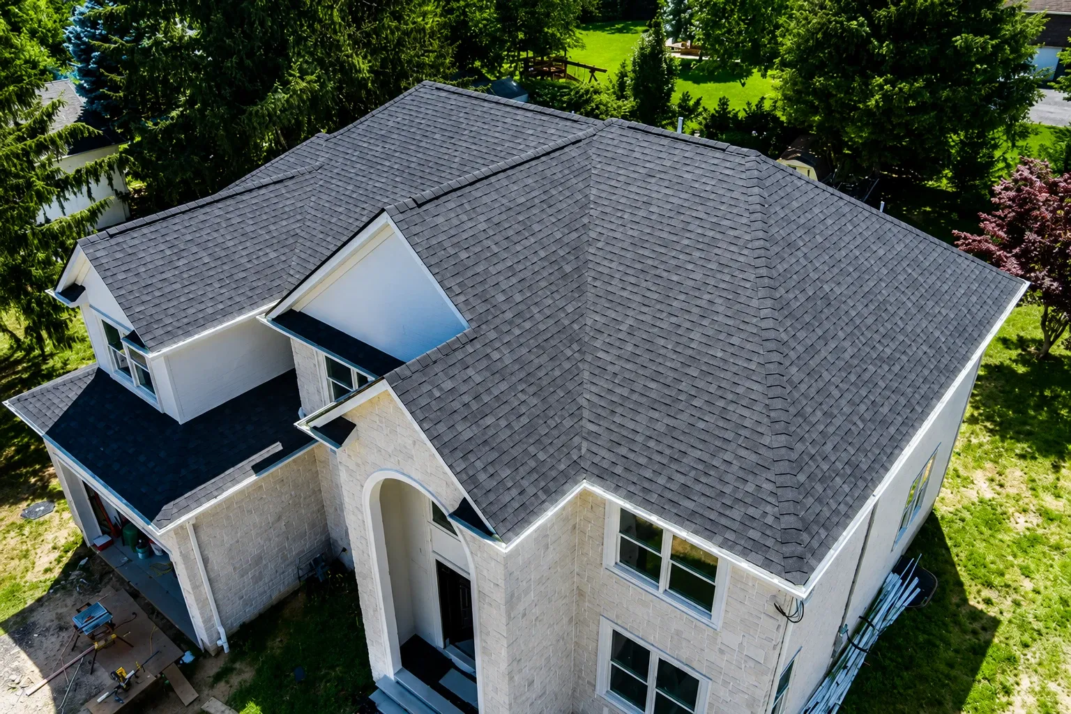 Aerial view of a new asphalt shingle roof on a home