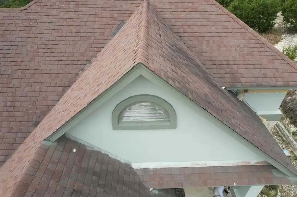 Brown shingle roof with a dormer vent on a Round Rock home