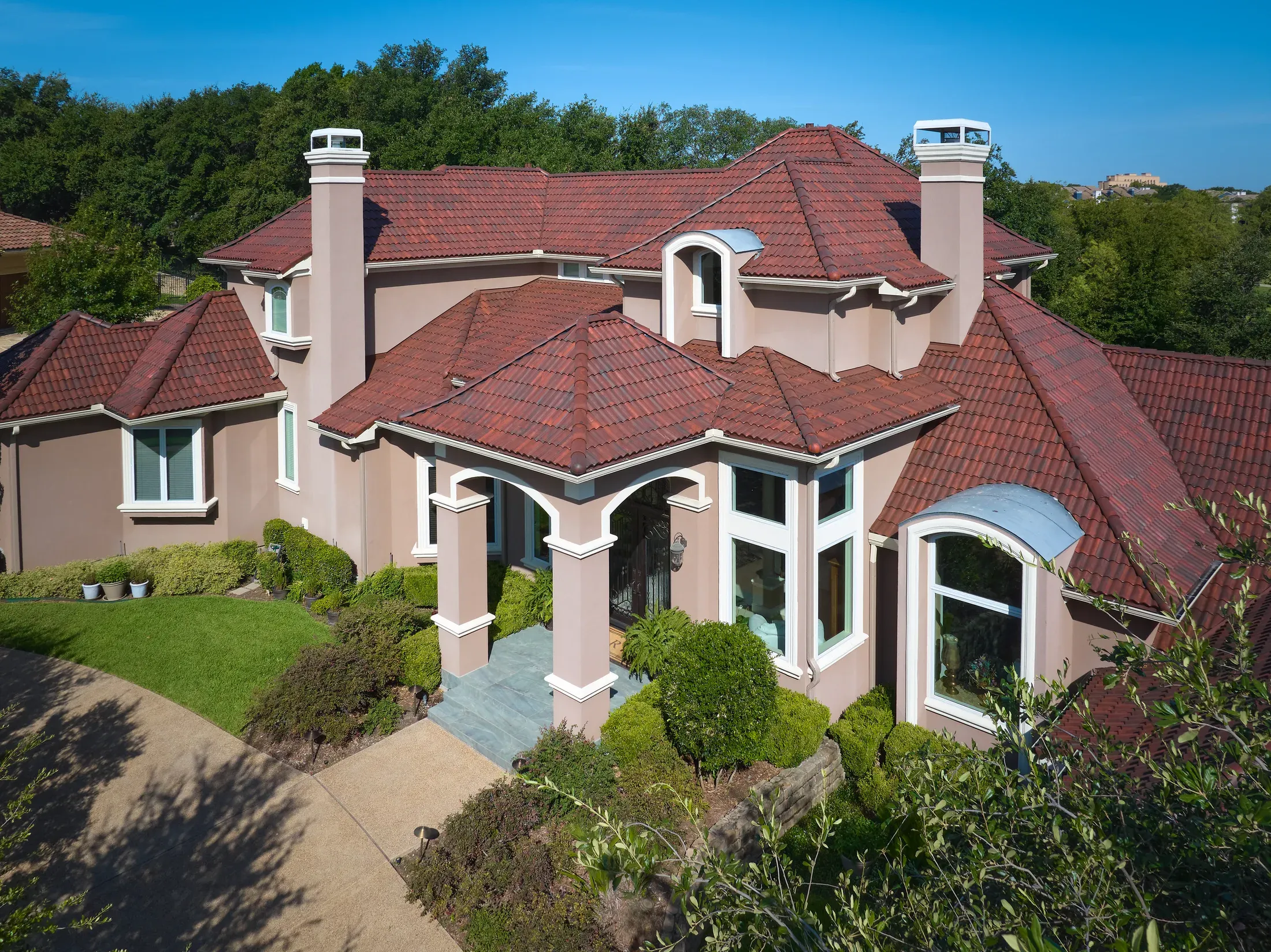 Brava Spanish Barrel Tile installed on a residential home in a red blended finish