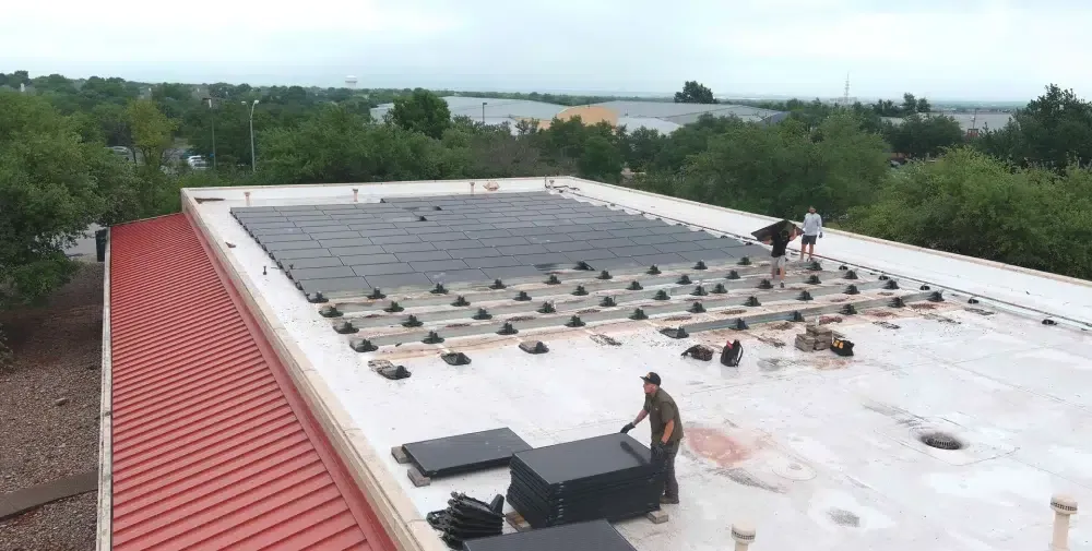 Ark crew performing technical commercial roof work in Leander