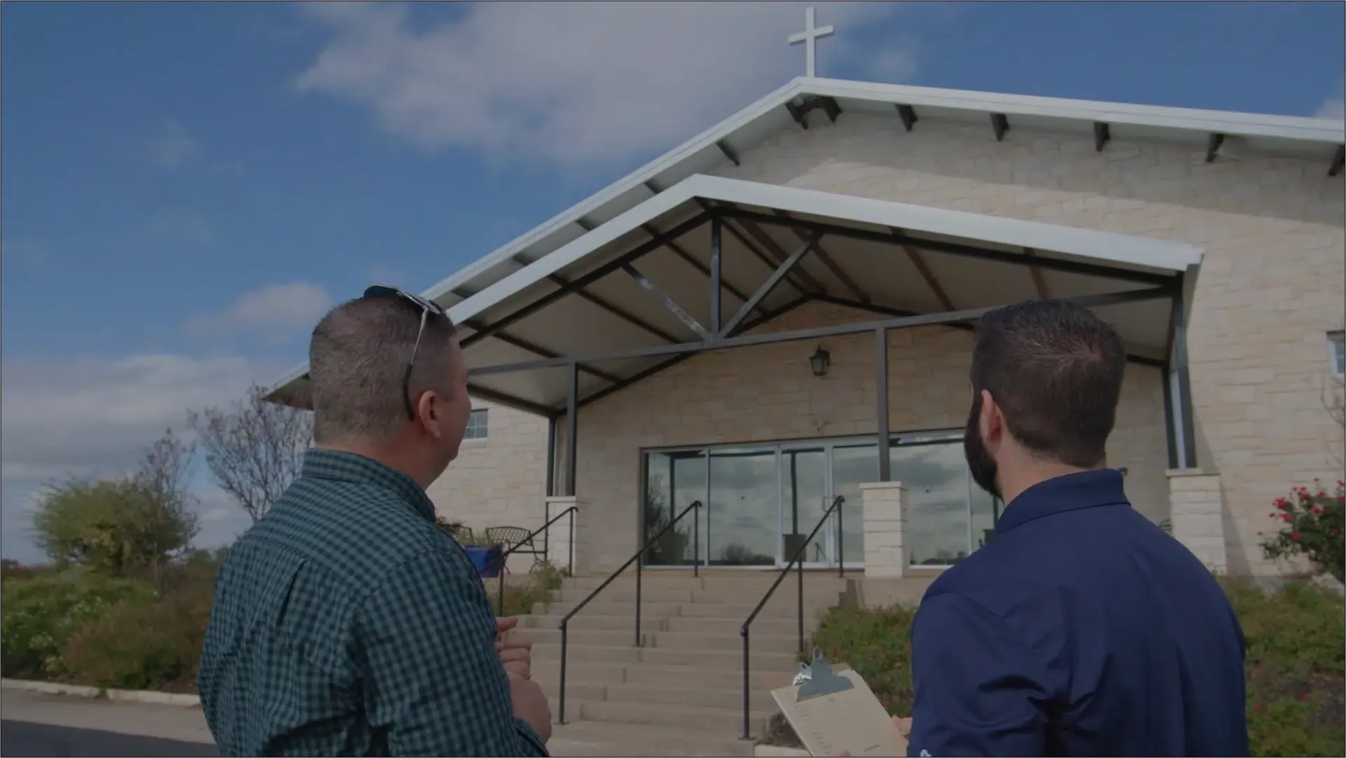Ark consultant reviewing a commercial roof with a property owner in Leander