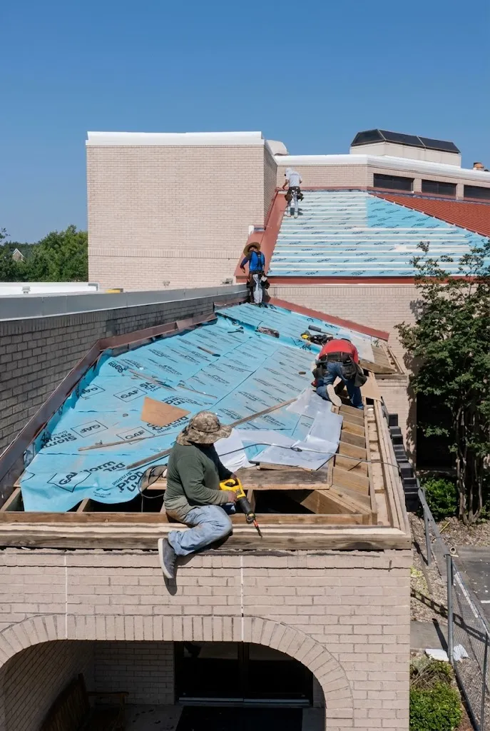 Ark crew repairing and replacing a hail-damaged Leander roof
