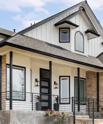 Newly installed exterior siding on a farmhouse-style home